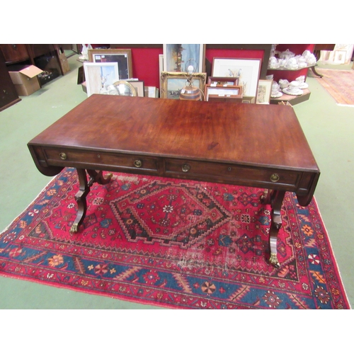 4108 - A Regency flame mahogany country house sofa table with black line inlay, the rising leaves over two ... 