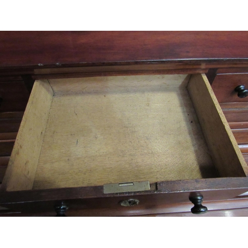 4172 - An early Victorian mahogany roll top desk, the three raised drawers over a tambour front (locking ke... 