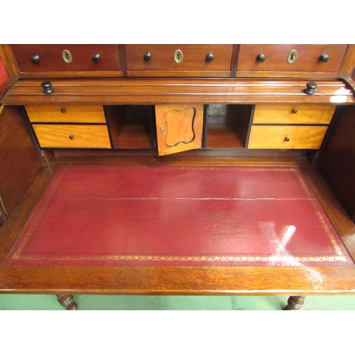 4172 - An early Victorian mahogany roll top desk, the three raised drawers over a tambour front (locking ke... 