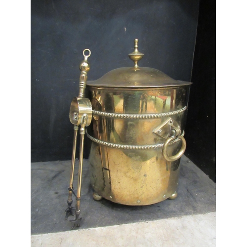 4182 - A brass lidded coal scuttle and a pair of tongs  (E)  £10-15