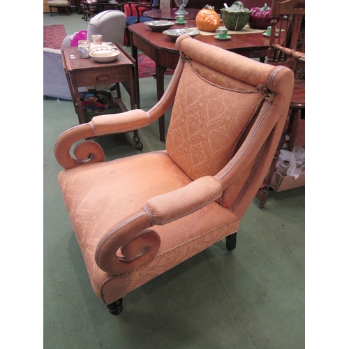 4190 - A 19th Century Irish armchair with scroll arms over ring turned fore legs and ceramic castors  (R)_ ... 