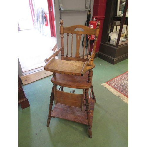 4192 - A metamorphic child's high chair, 104cm tall