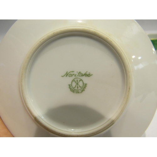 4199 - A Noritake set of six coffee cans and saucers, green ground with floral design, one can a/f