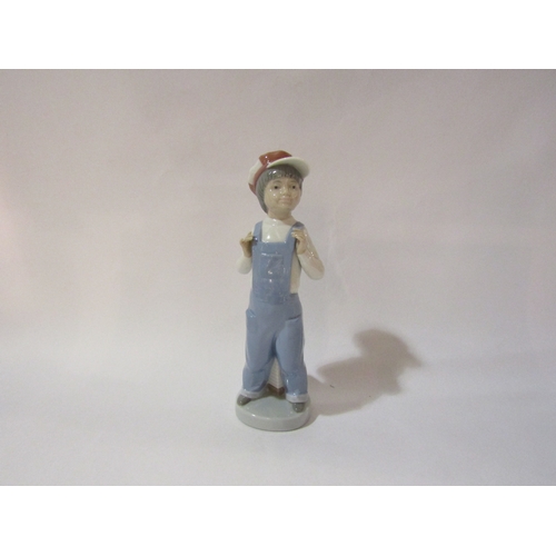 4293 - A Lladro figure of a boy with squeeze box  (boxed)