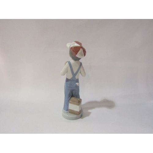 4293 - A Lladro figure of a boy with squeeze box  (boxed)