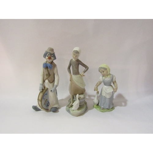 4322 - A Lladro girl with duck and two similar figures (3)