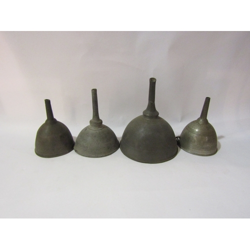 4345 - Four various pewter wine funnels, 13, 10, two 9cm diameter