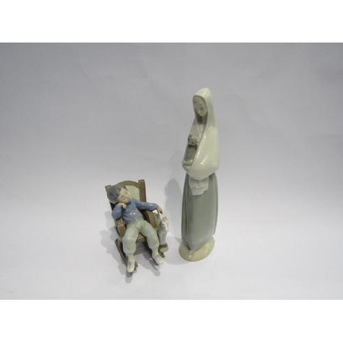 4508 - A Lladro figure of a boy in rocking chair and similar figure of a girl and cat (2)