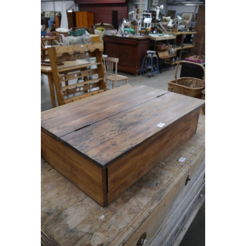 2284 - A pine style table top desk, rising lid, pigeon interior