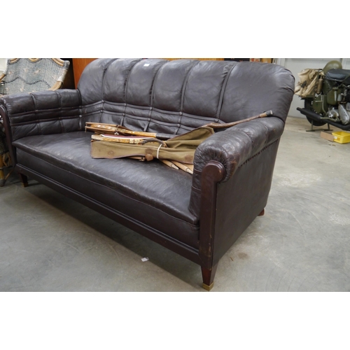 2480 - An Art Deco brown button leather sofa on mahogany square tapering legs   (E) £20-30