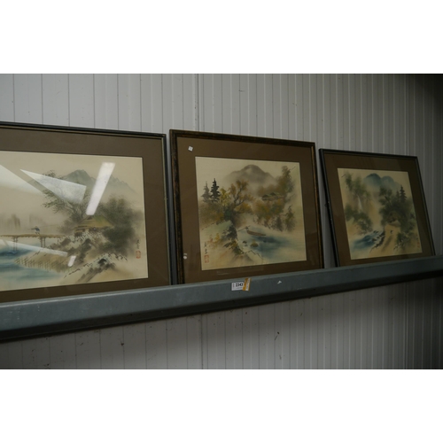 2452 - Three 20th Century Oriental paintings on silk of mountainous landscapes