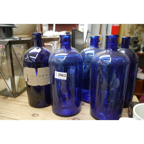 2062 - Five blue glass bottles