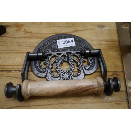 2064 - A Victorian style cast iron toilet roll holder, St Pancras with two hammers