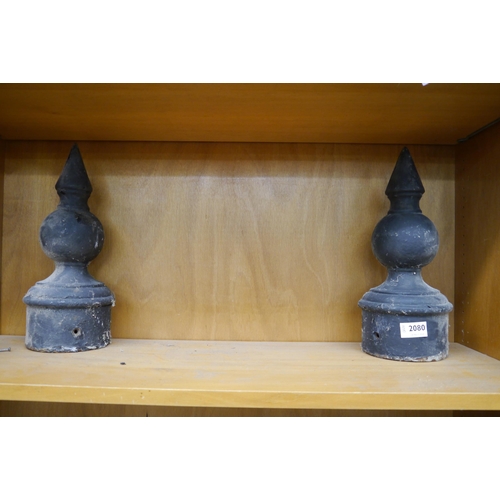 2080 - A pair of cast iron gate post finials 36cms tall