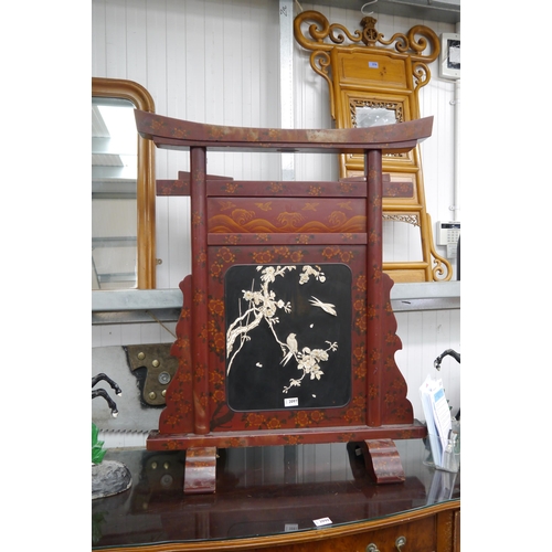 2097 - An Oriental chinoisserie screen, centre panel applied with bone bird in apple blossom, 97cm tall