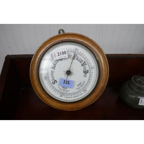 2100 - A Falls aneroid barometer, circular form