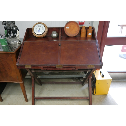 2104 - A leather desk on fold out stand