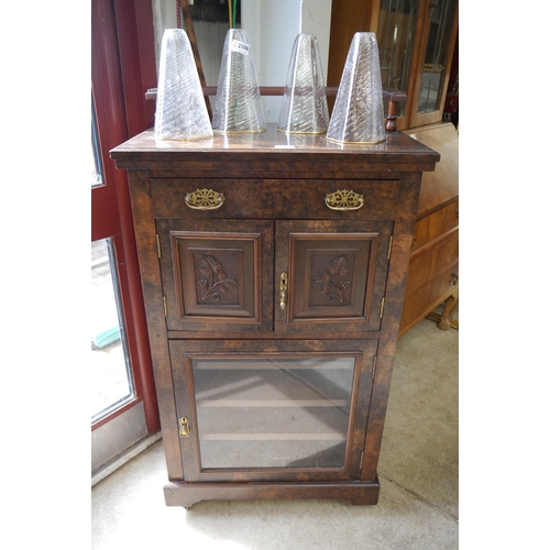 2105 - A Victorian walnut music cabinet, galleried back, single drawer over twin cupboards and lower glazed... 