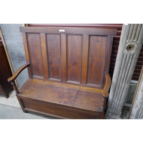 2113 - A Georgian elm panel back settle with box storage seat   (C)