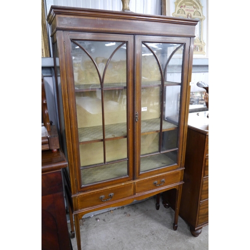 2125 - An Edwardian mahogany display cabinet astragal glazed doors, two drawers, spade feet