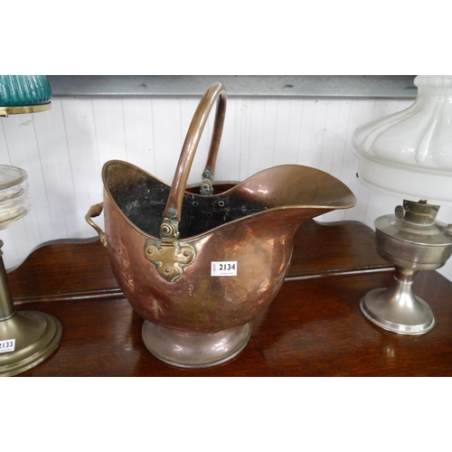 2134 - A copper brass handled coal helmet with copper and brass shovel   (R) £20