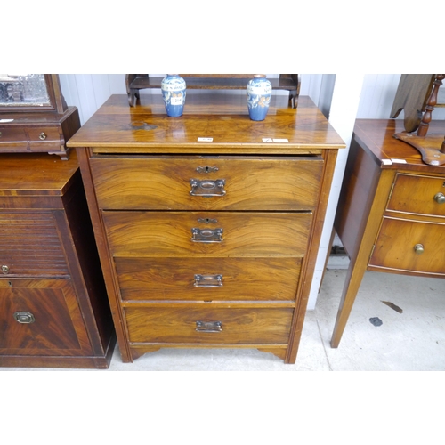 2140 - An Edwardian walnut chest of four drawers