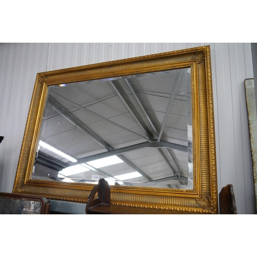 2144 - An ornate gilt framed overmantel mirror 112 x 80cm