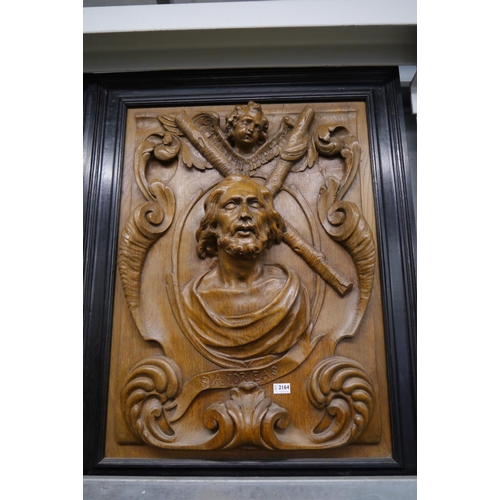 2164 - An 18th Century carved oak panel of St Andreas in black frame 85 x 108cm   (R) £700