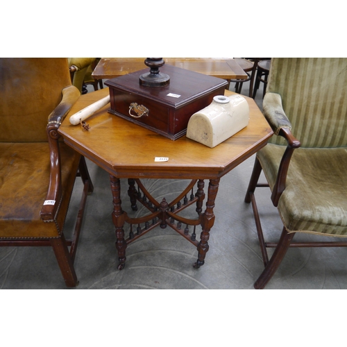 2179 - An Edwardian occasional octagonal table, turned legs, porcelain castors, lower tier