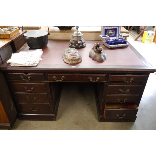 2203 - A mahogany twin pedestal desk with later rexin top, damage to top left hand drawer   (E) £20-30