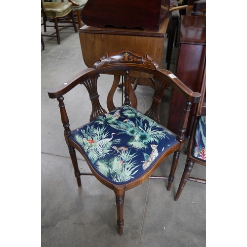 2218 - An Edwardian inlaid corner chair, jungle print upholstery