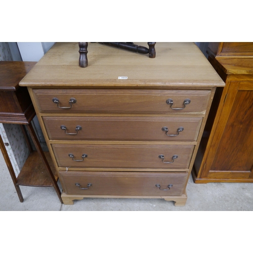 2233 - A oak chest of drawers, four long drawers, bracket feet