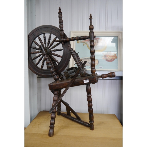 2234 - An oak spinning wheel   (R) £30