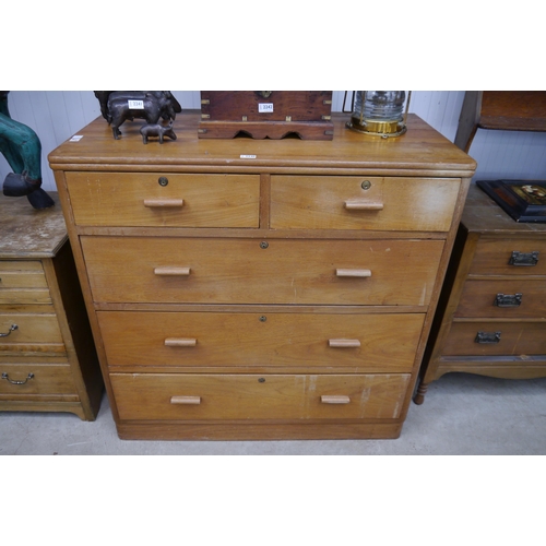 2240 - A mid century oak chest of two short over three long drawers