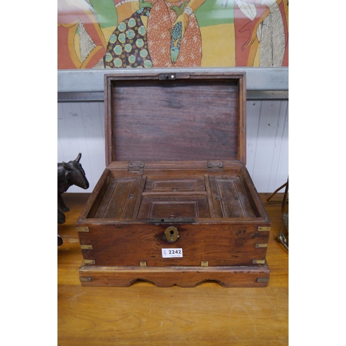 2242 - An Eastern hardwood table top, brass mounted