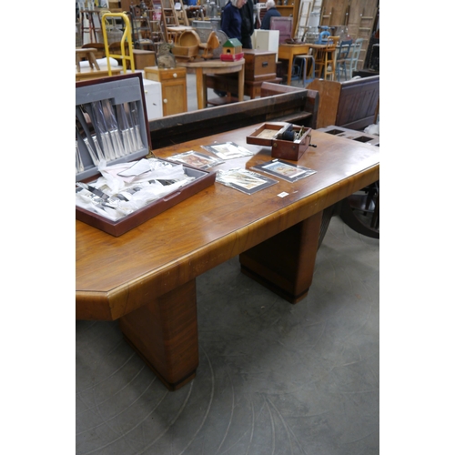 2251 - An Art Deco figured walnut dining table