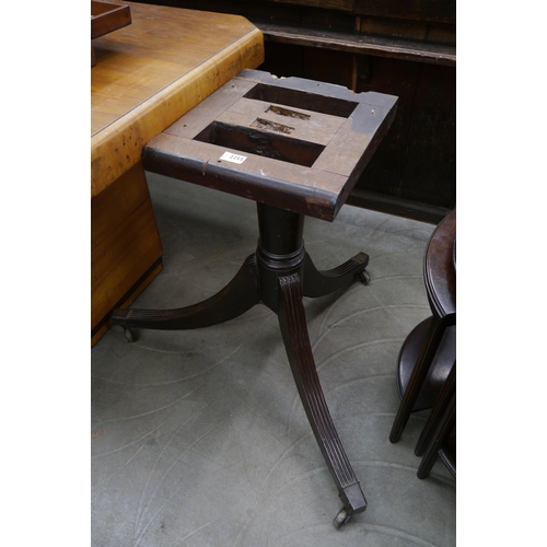 2255 - A 19th Century mahogany table base outswept reeded legs brass castors