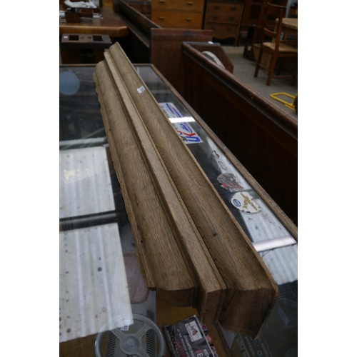 2262 - A Victorian stripped oak overmantel shelf 142cm long