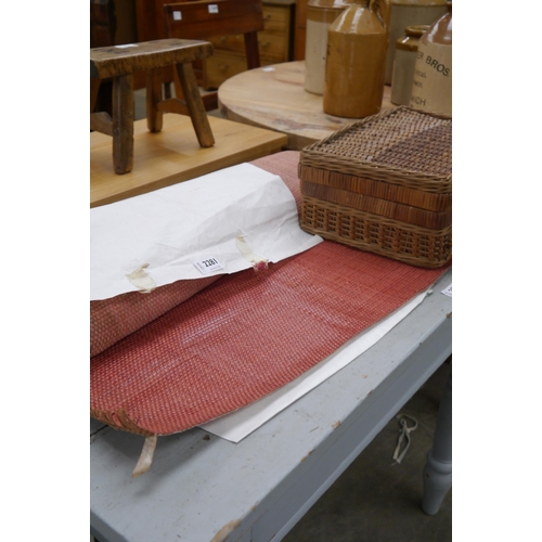 2281 - A roll of woven leather and picnic basket of craft items