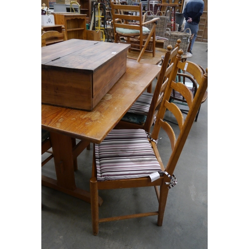 2283 - A pine trestle table and four chairs   (E) £10-15