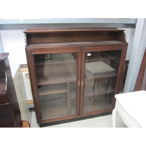 2453 - A mahogany bookcase, single shelf to top section, twin glazed doors, shelved interior