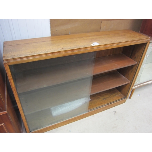 2461 - An oak half-height bookcase with sliding glass doors   (R) £0  (E) £10-15