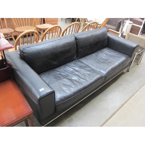 2464 - A black leather and chrome framed sofa    (E) £80-120