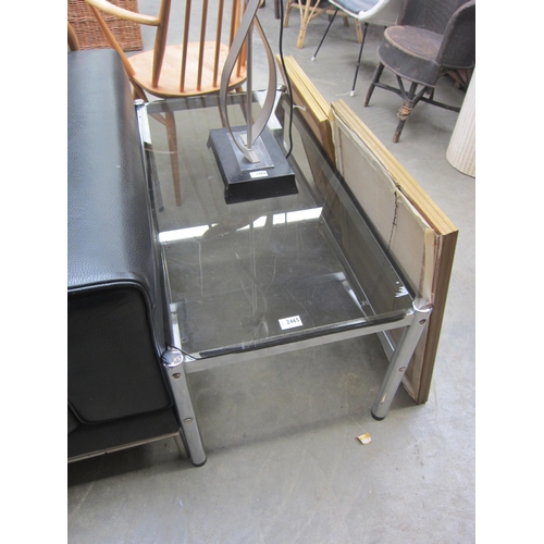 2465 - A chrome and smoke glass top coffee table   (E) £10-15