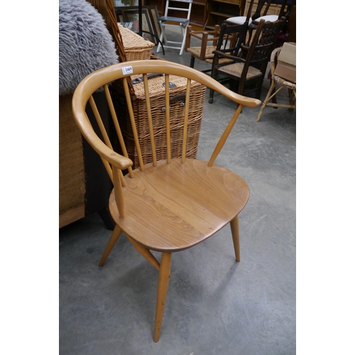 2469 - An Ercol cow horn single chair