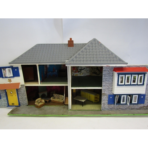 1072 - A wooden dolls house with sliding front, 43cm tall x 84cm wide