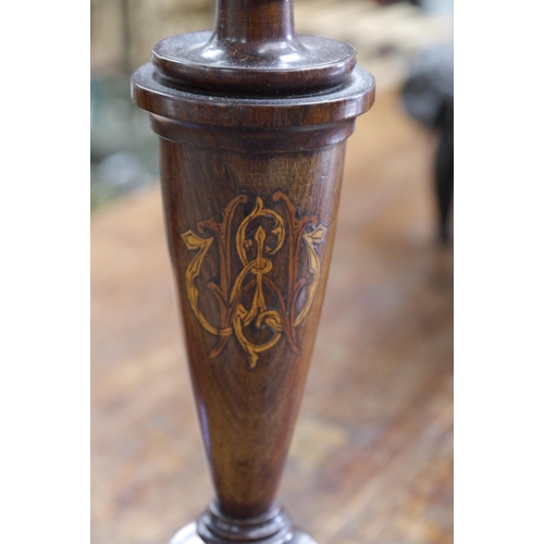 2002 - A pair of Regency rosewood inlaid candle sticks