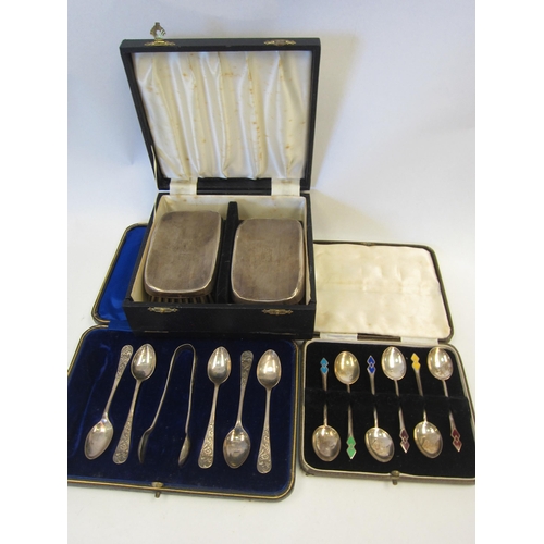 1351 - Five silver teaspoons, pair of silver tongs, a set of six silver enamel teaspoons and a pair of silv... 