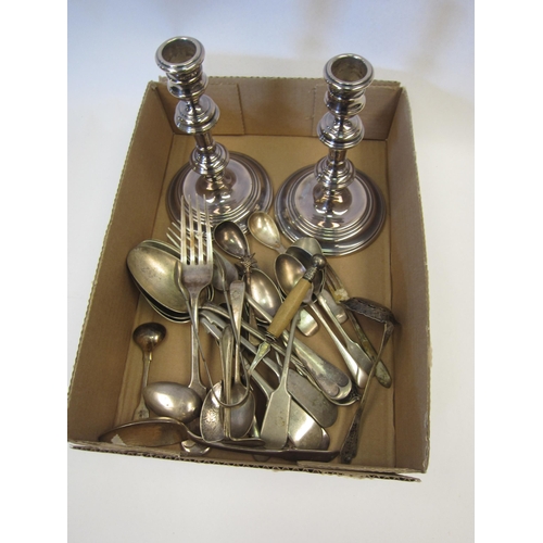 1360 - A pair of weighted silver candlesticks, two silver spoons and a small quantity of plated wares