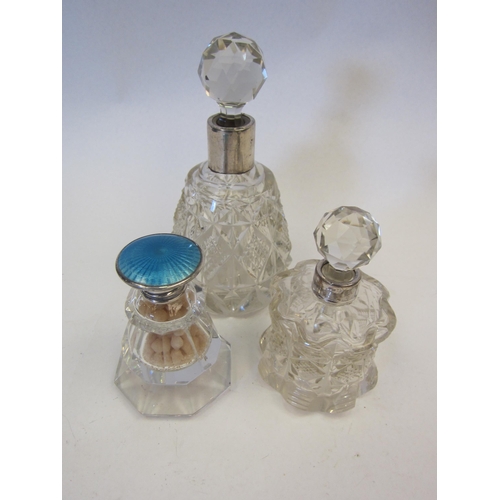 1364 - Two glass silver collared dressing table pots and another with blue enamel lid (3)